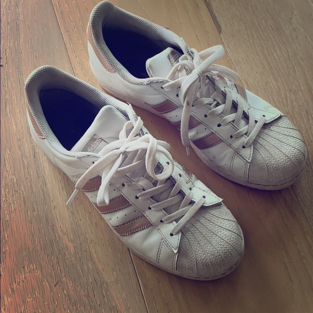 Women’s rose gold adidas superstar sneakers